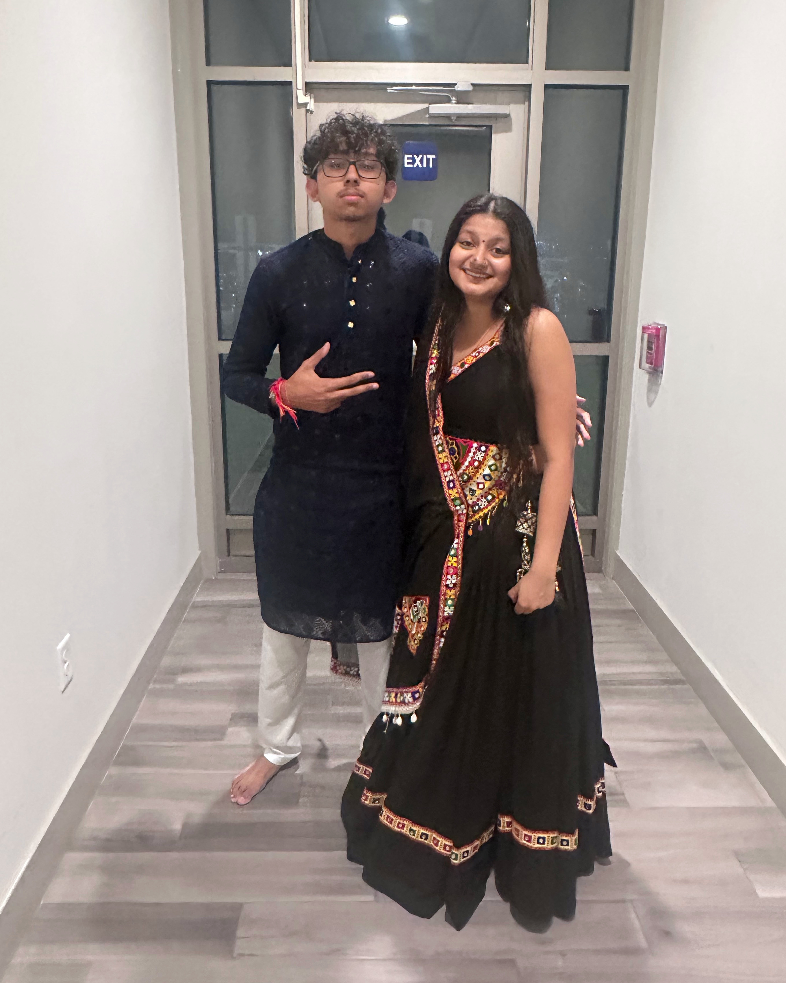 The two of us together at Garba, wearing navy and black traditional outfits.
